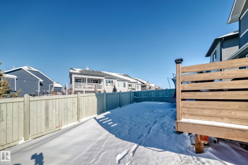 Fenced backyard featuring a residential view - 3716 46 Avenue, Beaumont, AB - Outdoor