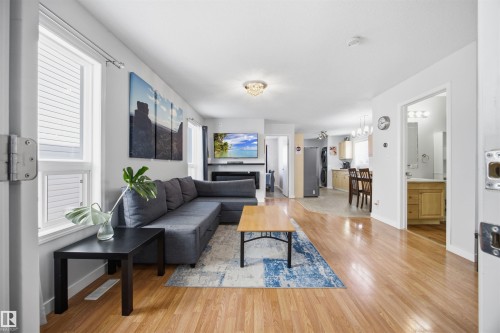 Living area featuring light wood finished floors and baseboards - 2340 30 Avenue, Edmonton, AB - Indoor Photo Showing Living Room