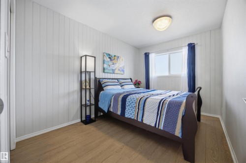 Bedroom featuring wood finished floors and baseboards - 2340 30 Avenue, Edmonton, AB - Indoor Photo Showing Bedroom