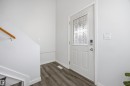 Entrance foyer featuring dark wood finished floors and baseboards - 2340 30 Avenue, Edmonton, AB  - Indoor Photo Showing Other Room 