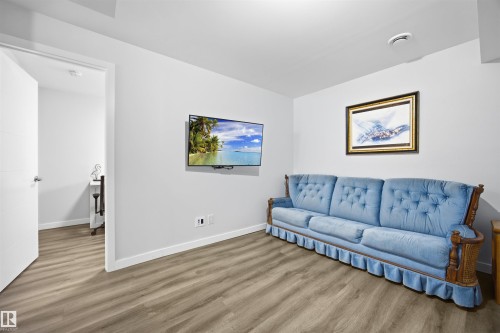 Living room with wood finished floors - 2340 30 Avenue, Edmonton, AB - Indoor Photo Showing Living Room