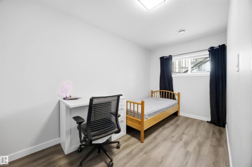 Bedroom featuring light wood-style floors - 2340 30 Avenue, Edmonton, AB - Indoor Photo Showing Other Room