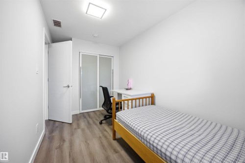Bedroom featuring wood finished floors and a closet - 2340 30 Avenue, Edmonton, AB - Indoor Photo Showing Bedroom