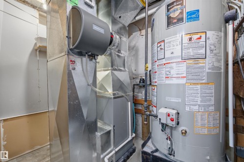 Utility room with water heater and heating unit - 2340 30 Avenue, Edmonton, AB - Indoor Photo Showing Basement
