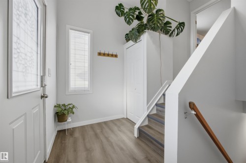 Entrance foyer with stairway and light wood-style floors - 2340 30 Avenue, Edmonton, AB - Indoor Photo Showing Other Room