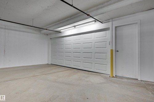 Private Quad Garage - 901 10035 Saskatchewan Drive, Edmonton, AB - Indoor Photo Showing Garage