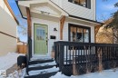 Snow covered property entrance with a wooden deck - 18717 57 Avenue, Edmonton, AB  - Outdoor 