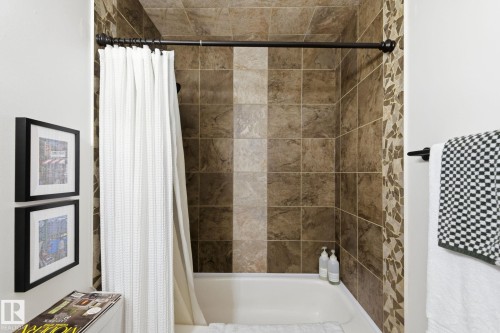 Full bath featuring shower / bathtub combination with curtain - 18717 57 Avenue, Edmonton, AB - Indoor Photo Showing Bathroom