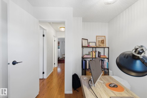 Home office featuring wood finished floors and a textured ceiling - 18717 57 Avenue, Edmonton, AB - Indoor Photo Showing Other Room