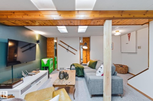 Living area with carpet - 18717 57 Avenue, Edmonton, AB - Indoor Photo Showing Basement