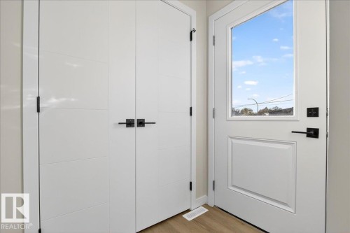 Entryway featuring wood finished floors - 10506 162 Street, Edmonton, AB - Indoor Photo Showing Other Room
