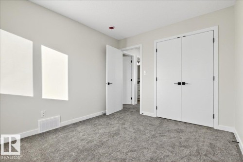 Unfurnished bedroom with carpet floors and a closet - 10506 162 Street, Edmonton, AB - Indoor Photo Showing Other Room