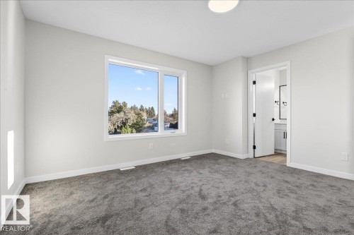 Unfurnished bedroom with carpet floors and ensuite bath - 10506 162 Street, Edmonton, AB - Indoor Photo Showing Other Room