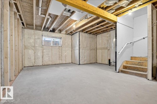 Unfinished basement with stairway - 10506 162 Street, Edmonton, AB - Indoor Photo Showing Basement