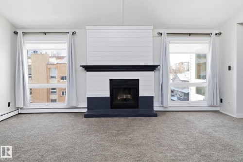 44 10172 118 Street, Edmonton, AB - Indoor Photo Showing Living Room With Fireplace
