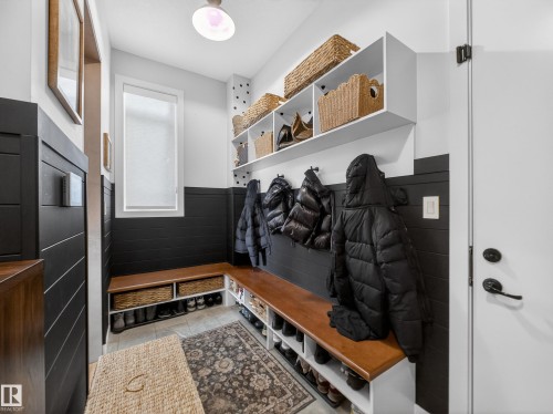 Mudroom featuring wainscoting and light tile patterned flooring - 5507 Chegwin Point(E), Edmonton, AB - Indoor Photo Showing Other Room