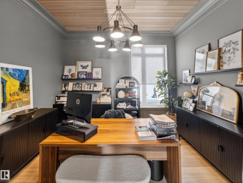 Office space with crown molding, wooden ceiling, wood finished floors, and hanging lights - 5507 Chegwin Point(E), Edmonton, AB - Indoor