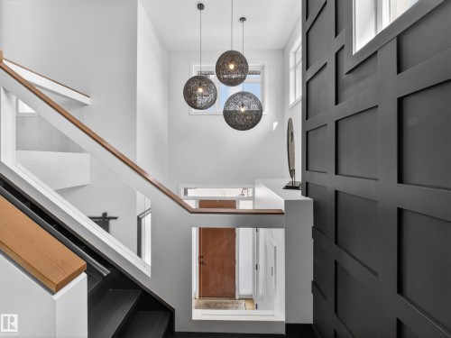 Entrance foyer with stairway - 5507 Chegwin Point(E), Edmonton, AB - Indoor Photo Showing Other Room