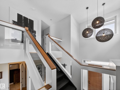 View of stairway - 5507 Chegwin Point(E), Edmonton, AB - Indoor Photo Showing Other Room