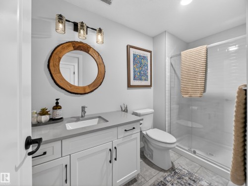Full bathroom with vanity and a stall shower - 5507 Chegwin Point(E), Edmonton, AB - Indoor Photo Showing Bathroom