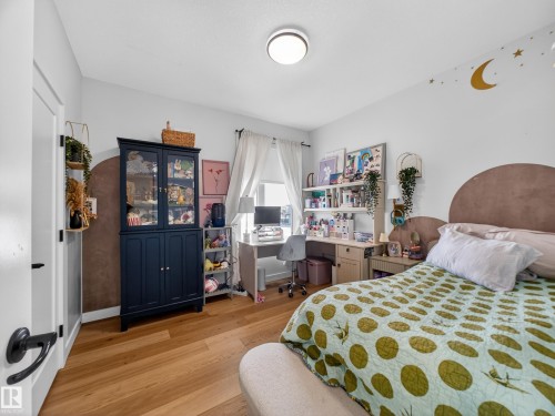 Bedroom featuring light wood-style floors and an office area - 5507 Chegwin Point(E), Edmonton, AB - Indoor Photo Showing Bedroom