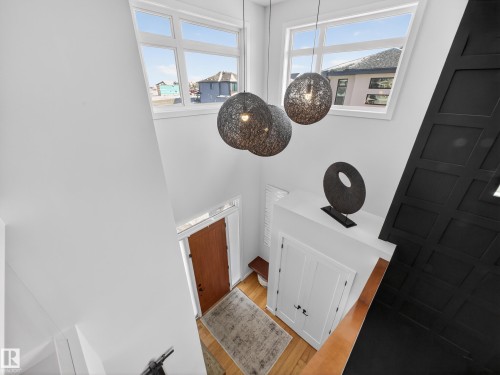 Detailed view of wood finished floors - 5507 Chegwin Point(E), Edmonton, AB - Indoor Photo Showing Other Room