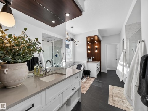 Full bath with a shower stall and two vanities - 5507 Chegwin Point(E), Edmonton, AB - Indoor