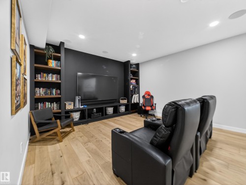 Living area featuring light wood-style flooring and recessed lighting - 5507 Chegwin Point(E), Edmonton, AB - Indoor