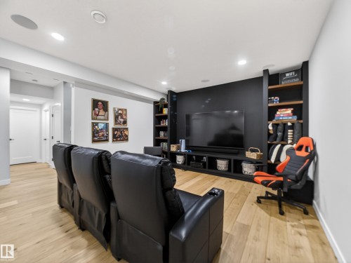 Cinema with light wood-style floors and recessed lighting - 5507 Chegwin Point(E), Edmonton, AB - Indoor