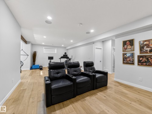 Cinema room with light wood-style flooring and recessed lighting - 5507 Chegwin Point(E), Edmonton, AB - Indoor