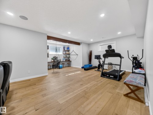 Workout area with light wood-style floors and recessed lighting - 5507 Chegwin Point(E), Edmonton, AB - Indoor Photo Showing Gym Room