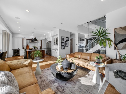 Living room featuring light wood-style floors, wine cooler, and recessed lighting - 5507 Chegwin Point(E), Edmonton, AB - Indoor Photo Showing Living Room