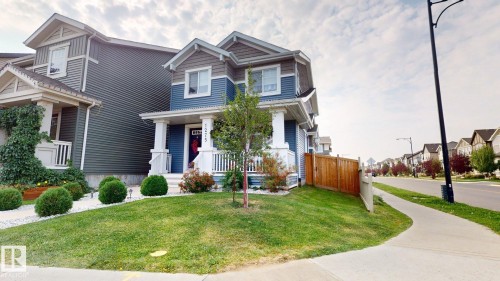 View of front of home featuring a porch and a residential view - 1275 Chappelle Boulevard Sw, Edmonton, AB - Outdoor With Facade