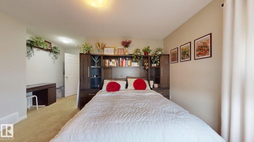 Bedroom with carpet and a textured ceiling - 1275 Chappelle Boulevard Sw, Edmonton, AB - Indoor Photo Showing Bedroom