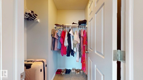 Walk in closet featuring carpet flooring - 1275 Chappelle Boulevard Sw, Edmonton, AB - Indoor With Storage