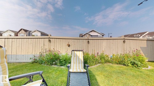 Fenced backyard featuring a residential view - 1275 Chappelle Boulevard Sw, Edmonton, AB - Outdoor
