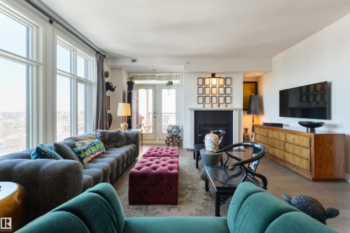 1107 9020 Jasper Avenue, Edmonton, AB - Indoor Photo Showing Living Room With Fireplace