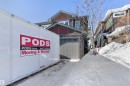 View of front of house featuring a garage and stone siding - 56 Durrand Bend, Fort Saskatchewan, AB  - Outdoor 