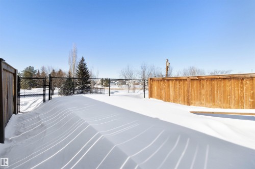 Yard layered in snow featuring a gate - 56 Durrand Bend, Fort Saskatchewan, AB - Outdoor