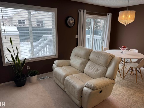 Living area featuring carpet flooring and a textured ceiling - 19 2021 Grantham Crest, Edmonton, AB - Indoor