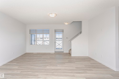 Spare room with light wood-style floors and a textured ceiling - 2412 192 Street, Edmonton, AB - Indoor Photo Showing Other Room