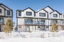 View of front facade featuring a fenced front yard, a balcony, and a residential view - 2412 192 Street, Edmonton, AB  - Outdoor With Facade 