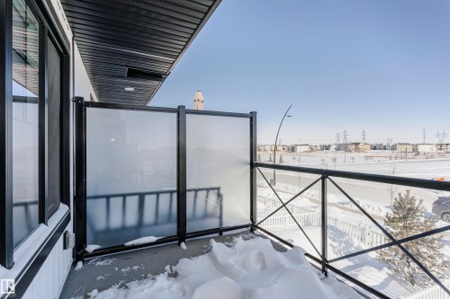 View of snow covered back of property - 2412 192 Street, Edmonton, AB - Outdoor With Balcony With Exterior