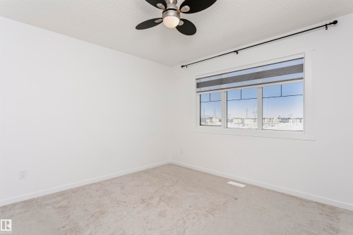 Spare room with carpet floors, a ceiling fan, and a textured ceiling - 2412 192 Street, Edmonton, AB - Indoor Photo Showing Other Room