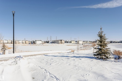 Snowy yard featuring a residential view - 2412 192 Street, Edmonton, AB - Outdoor With View