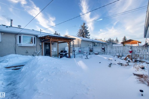 Snow covered house with a patio and stucco siding - 9907 165 Street, Edmonton, AB - Outdoor
