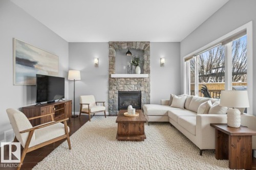 90 Hilldowns Drive, Spruce Grove, AB - Indoor Photo Showing Living Room With Fireplace