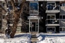 Snow covered property featuring a view of apartment building / complex - 15 10620 122 Street, Edmonton, AB  - Outdoor 