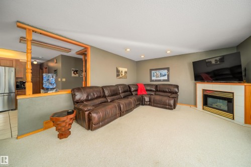6931 14 Avenue, Edmonton, AB - Indoor Photo Showing Other Room With Fireplace