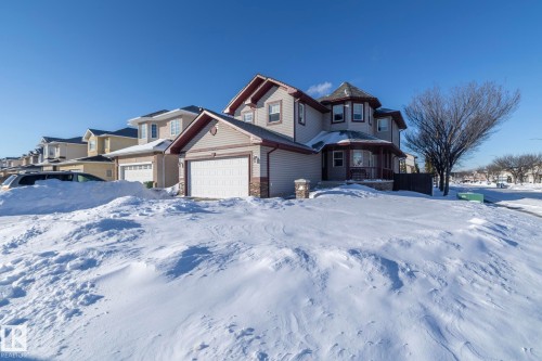 Victorian house featuring stone siding and a residential view - 16454 61A Street, Edmonton, AB - Outdoor With Facade